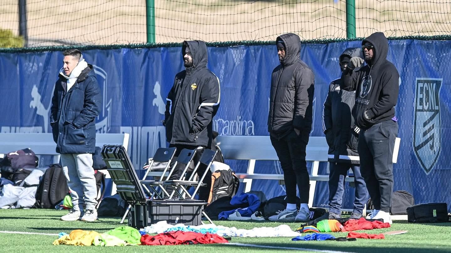 Droom Soccer coaching staff on the sideline